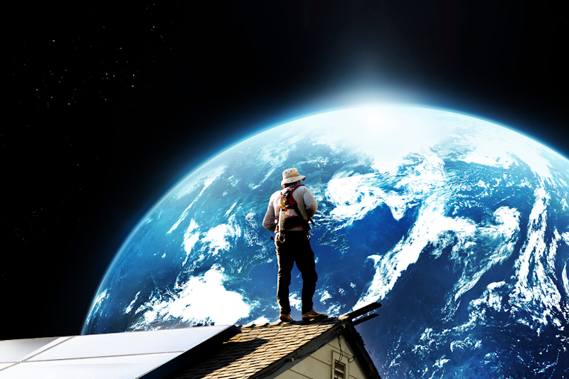 A man on a roof in space staring off towards Earth