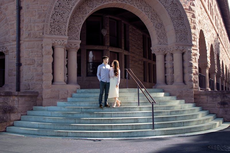A couple standing on the steps of Stanford University